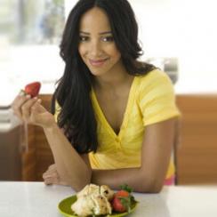 Woman eating strawberries