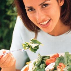 Woman eating salad